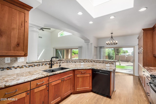 2226 N Gentry, Mesa, AZ 85213 - kitchen featuring dishwasher, a sink, brown cabinets, light wood-style floors, and healthy amount of natural light