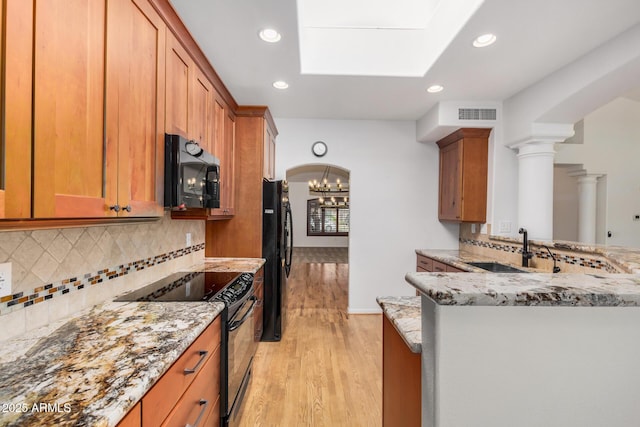 2226 N Gentry, Mesa, AZ 85213 - kitchen with black appliances, light wood-style floors, a sink, light stone counters, and recessed lighting