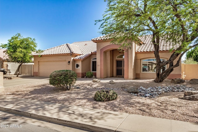 2226 N Gentry, Mesa, AZ 85213 - mediterranean / spanish-style house featuring stucco siding, a tiled roof, a garage, and driveway