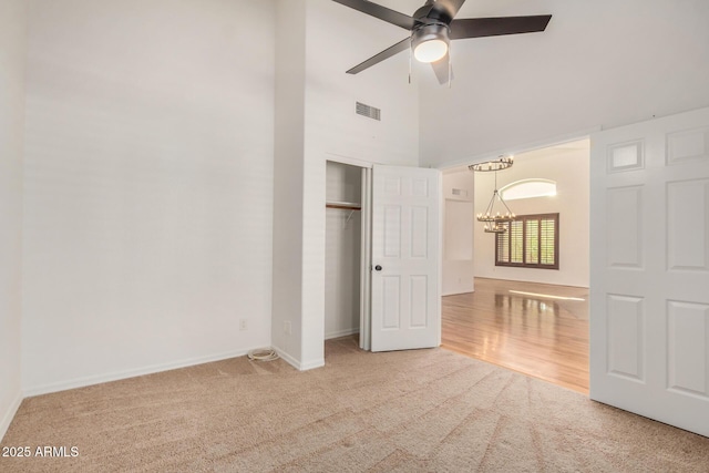 2226 N Gentry, Mesa, AZ 85213 - unfurnished bedroom with a chandelier, carpet floors, a high ceiling, baseboards, and a closet