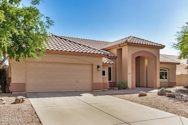 2226 N Gentry, Mesa, AZ 85213 - view of front of property featuring stucco siding, concrete driveway, a tiled roof, and a garage