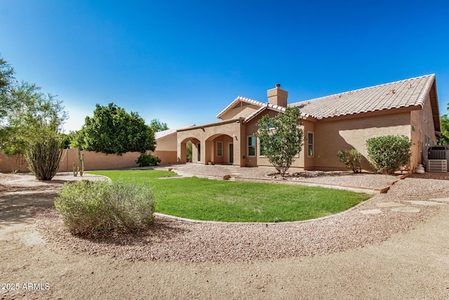 2226 N Gentry, Mesa, AZ 85213 - view of front of home with a chimney, stucco siding, a tile roof, and central air condition unit