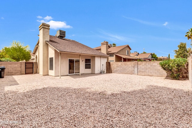 1811 S 39th St Unit 30, Mesa, AZ 85206 - rear view of property with a chimney, a fenced backyard, stucco siding, a patio area, and roof with shingles