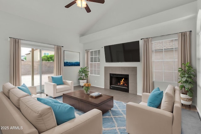 1811 S 39th St Unit 30, Mesa, AZ 85206 - living room featuring ceiling fan, a tile fireplace, high vaulted ceiling, tile patterned flooring, and baseboards