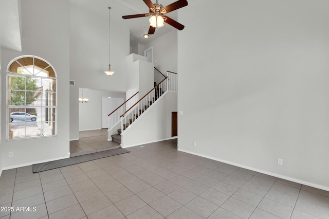 1811 S 39th St Unit 30, Mesa, AZ 85206 - tiled foyer with stairway, a towering ceiling, ceiling fan, baseboards, and a chandelier