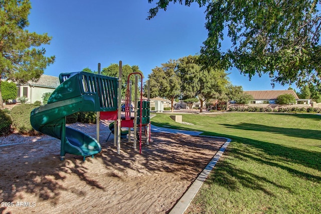 view of playground with a lawn