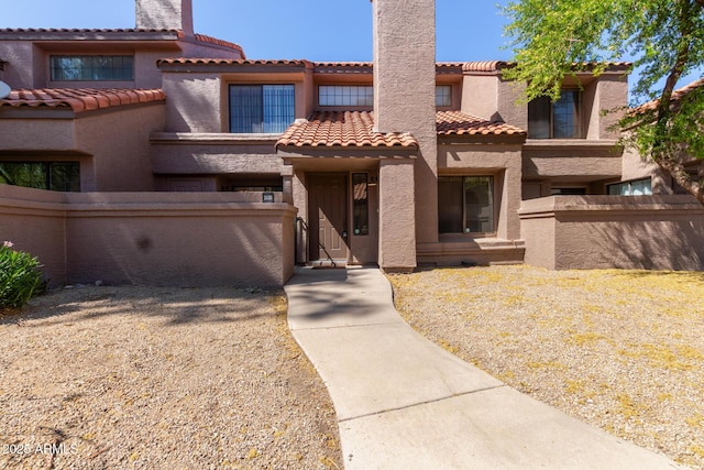 609 E Mesquite Cir Unit D133, Tempe, AZ 85288 - mediterranean / spanish home with a tiled roof, stucco siding, and a chimney