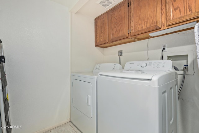 609 E Mesquite Cir Unit D133, Tempe, AZ 85288 - washroom featuring cabinet space, washer and dryer, and light tile patterned floors