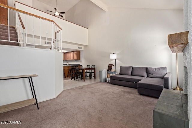 609 E Mesquite Cir Unit D133, Tempe, AZ 85288 - living area featuring stairs, a ceiling fan, light carpet, high vaulted ceiling, and beam ceiling