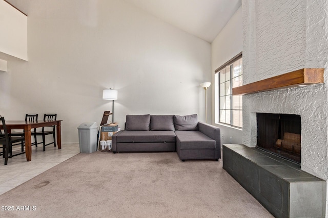 609 E Mesquite Cir Unit D133, Tempe, AZ 85288 - carpeted living area featuring high vaulted ceiling, a fireplace with raised hearth, and tile patterned flooring