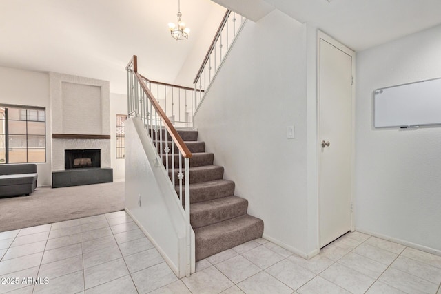 609 E Mesquite Cir Unit D133, Tempe, AZ 85288 - stairs featuring tile patterned floors, carpet floors, a chandelier, and a large fireplace