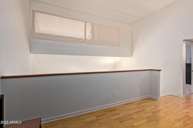 609 E Mesquite Cir Unit D133, Tempe, AZ 85288 - spare room with light wood-type flooring and baseboards