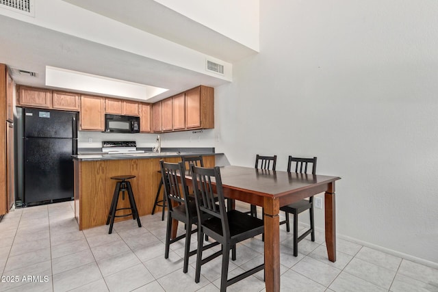 609 E Mesquite Cir Unit D133, Tempe, AZ 85288 - dining space featuring light tile patterned flooring