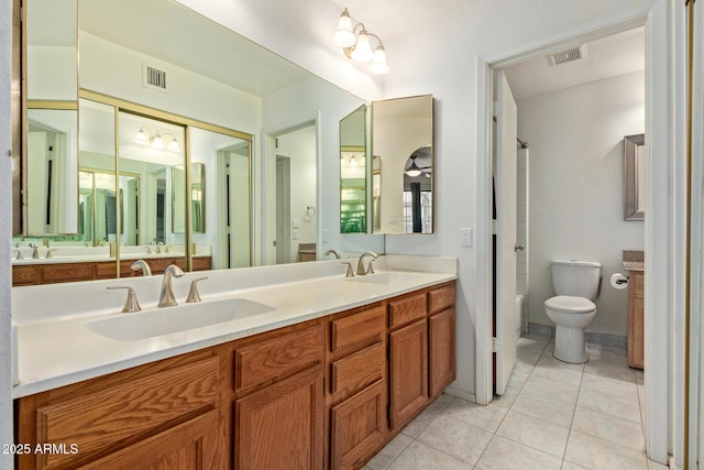 609 E Mesquite Cir Unit D133, Tempe, AZ 85288 - bathroom with double vanity and tile patterned flooring