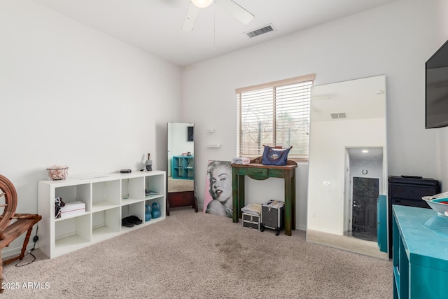 misc room featuring visible vents, carpet, and ceiling fan