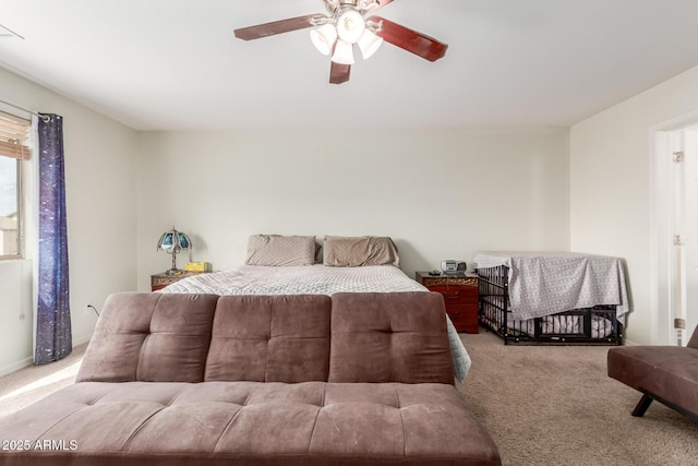 carpeted bedroom with a ceiling fan