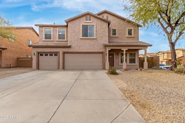 traditional-style home featuring stucco siding, driveway, an attached garage, and fence