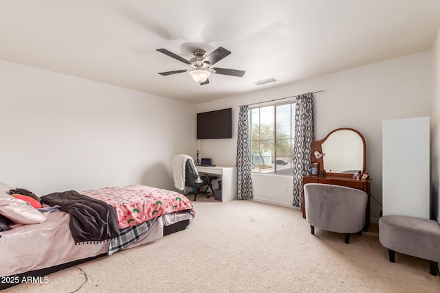 carpeted bedroom featuring visible vents and ceiling fan