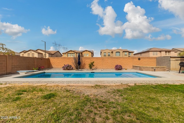 view of pool featuring a fenced in pool, a yard, a fenced backyard, a patio, and a diving board