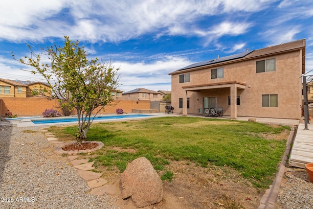 view of yard featuring a patio area, a fenced backyard, and a fenced in pool