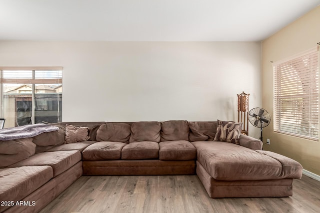 living room with wood finished floors and baseboards