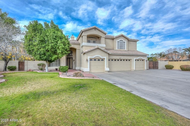 mediterranean / spanish-style home with a garage and a front yard