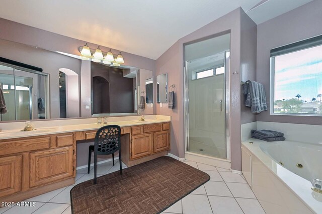 bathroom with tile patterned floors, separate shower and tub, vanity, and vaulted ceiling