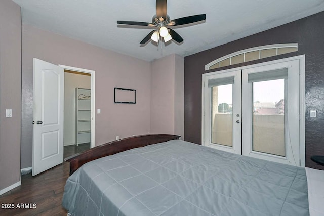 bedroom featuring ceiling fan, dark wood-type flooring, and french doors