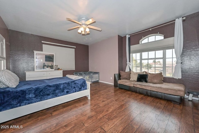 bedroom with ceiling fan and dark wood-type flooring