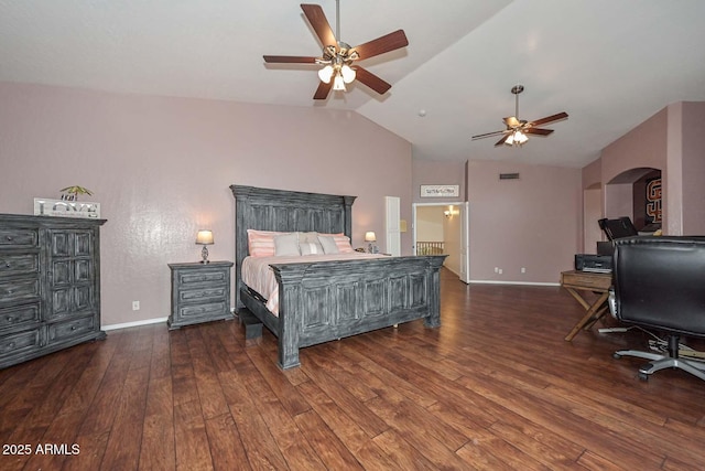 bedroom featuring dark hardwood / wood-style flooring, vaulted ceiling, and ceiling fan