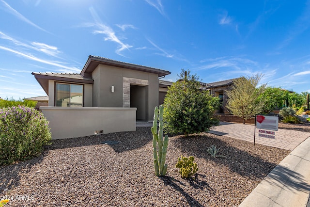 view of front of home with a patio area