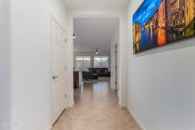 hallway featuring light tile patterned floors