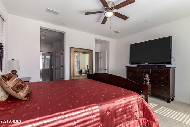 bedroom with ceiling fan and light carpet