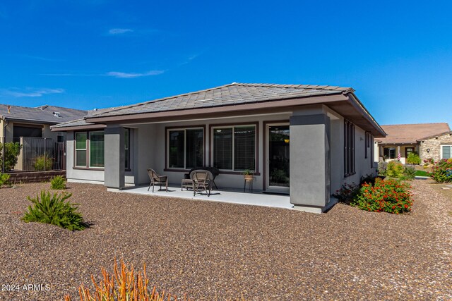 back of house with a patio