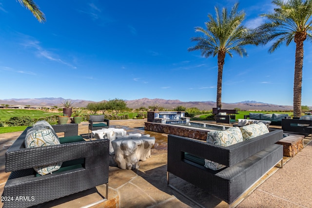 view of patio with a mountain view and outdoor lounge area