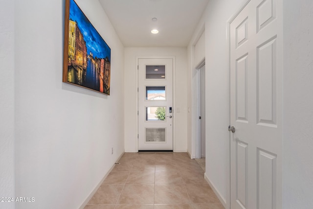 corridor with light tile patterned flooring