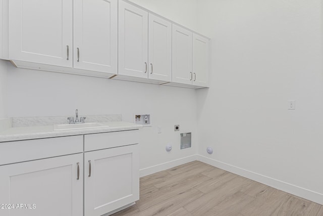 washroom with hookup for a washing machine, gas dryer hookup, cabinet space, electric dryer hookup, and a sink