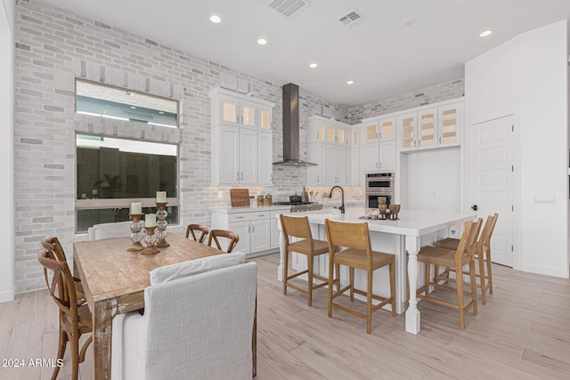 dining space with visible vents, recessed lighting, and light wood-type flooring