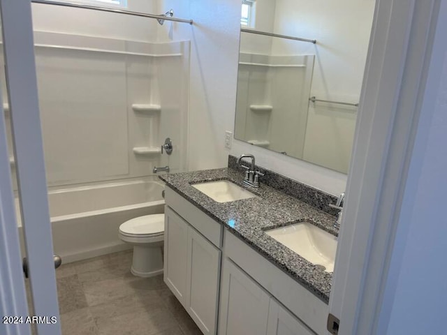 full bathroom featuring vanity, toilet, and shower / washtub combination