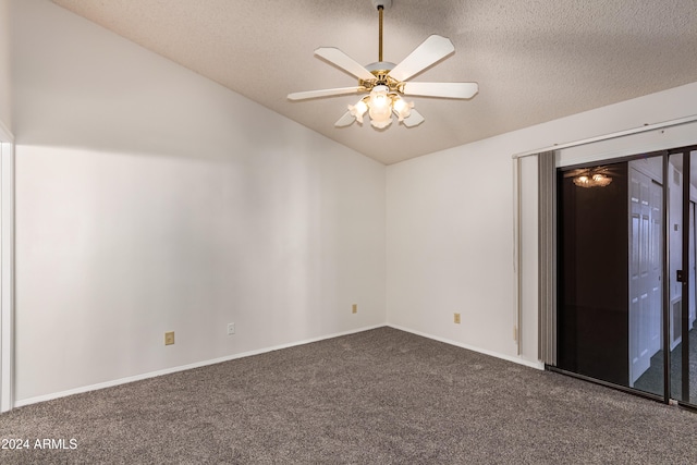 carpeted empty room with a textured ceiling, ceiling fan, and lofted ceiling