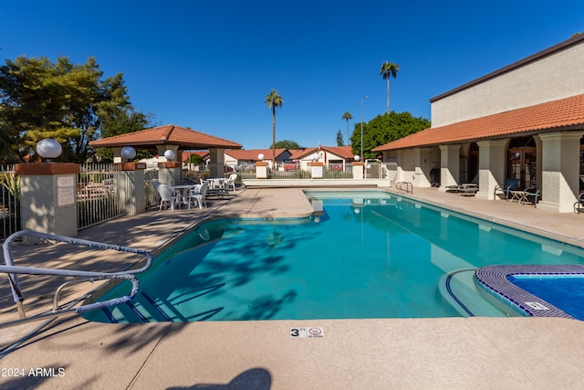 view of swimming pool featuring a gazebo and a patio