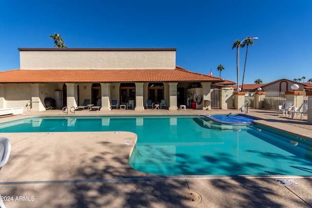 view of swimming pool with a patio area