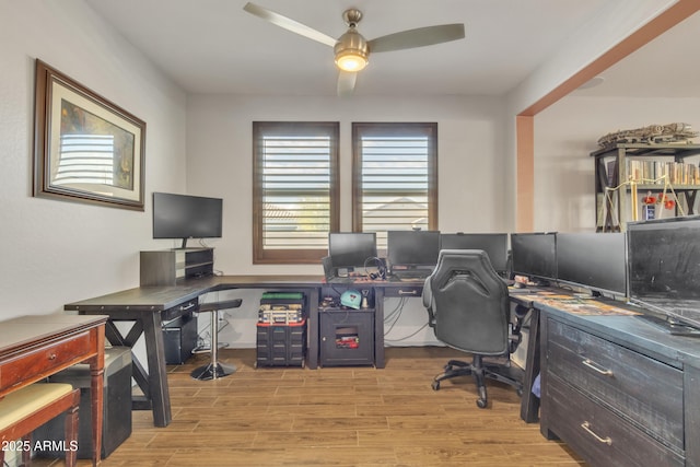 office space with a ceiling fan and light wood finished floors