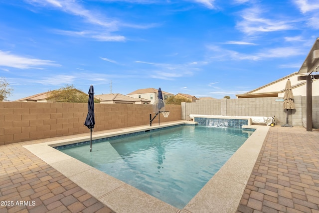 view of pool with a fenced backyard, a fenced in pool, and a patio