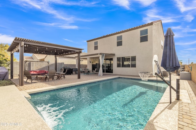 back of house featuring a patio, fence, a fenced in pool, stucco siding, and a pergola