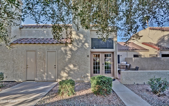 602 N May Unit 23, Mesa, AZ 85201 - view of front of house featuring stucco siding, a tile roof, and fence