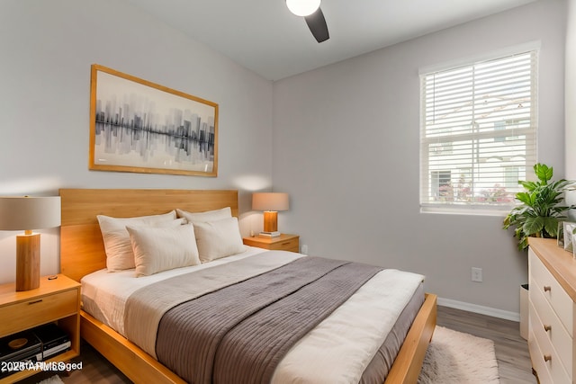 bedroom featuring ceiling fan and wood-type flooring