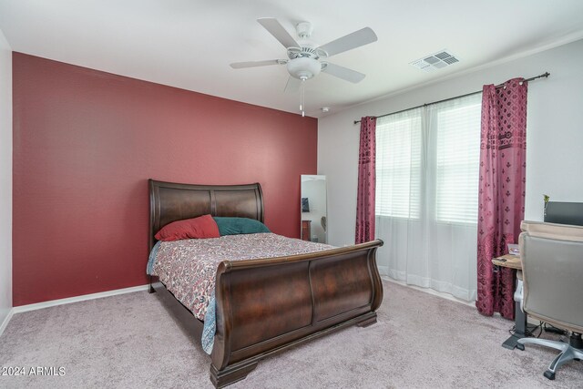 bedroom with light carpet and ceiling fan