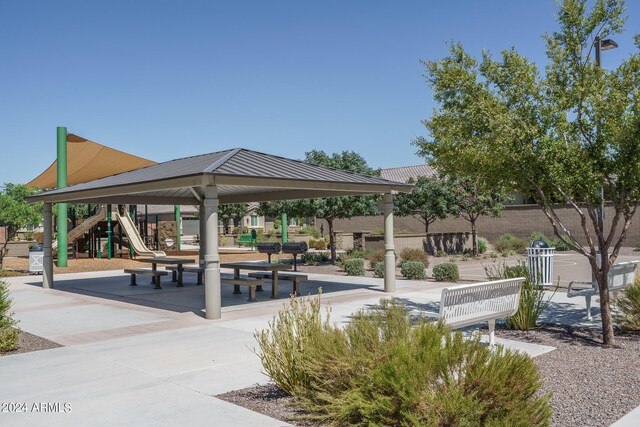 view of property's community featuring a playground and a gazebo