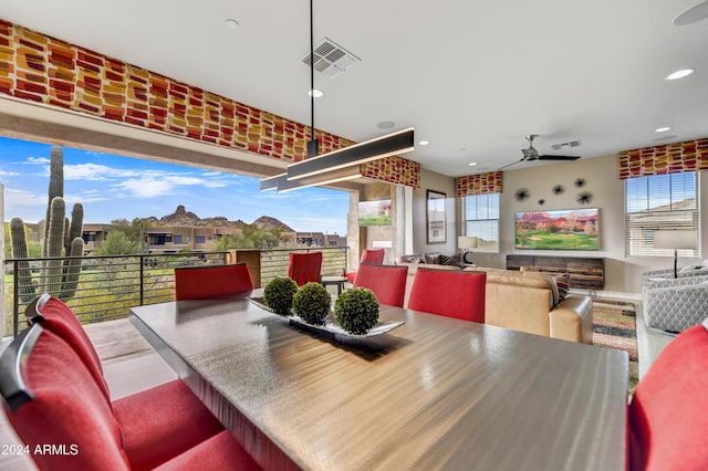 dining space with ceiling fan and a healthy amount of sunlight